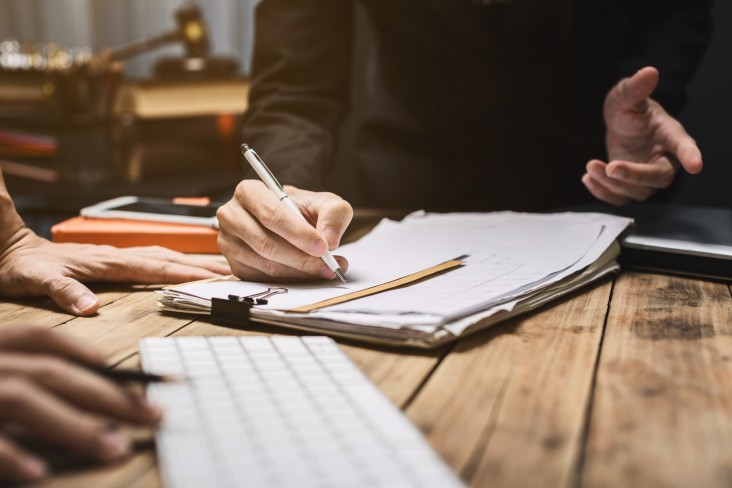 People writing and discussing