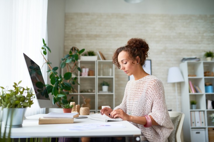 Woman works at computer